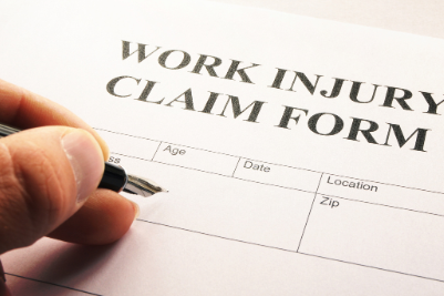 Worker holding an injury form with a concerned expression, unsure about workers' compensation process
